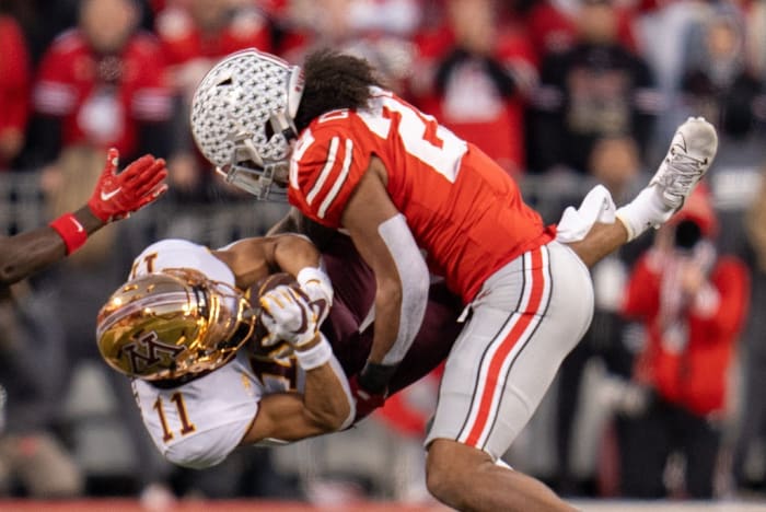 Nov 18, 2023; Columbus, Ohio, USA; Ohio State Buckeyes linebacker Steele Chambers (22) tackles Minnesota Golden Gophers wide receiver Elijah Spencer (11) during the first half of their game on Saturday, Nov. 18, 2023 at Ohio Stadium.